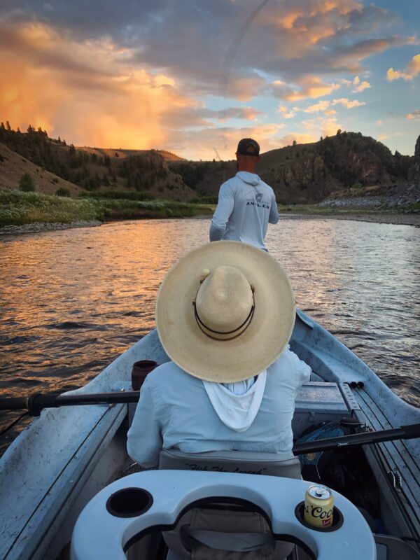 Fly fisherman casting a line on a full-day guided float trip in Gunnison River.